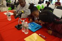 Teams of sixth graders from three Philadelphia schools used iPads to buzz in and answer literature questions. 